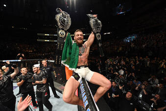 NEW YORK, NY - NOVEMBER 12: UFC lightweight and featherweight champion Conor McGregor of Ireland celebrates after defeating Eddie Alvarez in their UFC lightweight championship fight during the UFC 205 event at Madison Square Garden on November 12, 2016 in New York City. (Photo by Jeff Bottari/Zuffa LLC/Zuffa LLC via Getty Images)